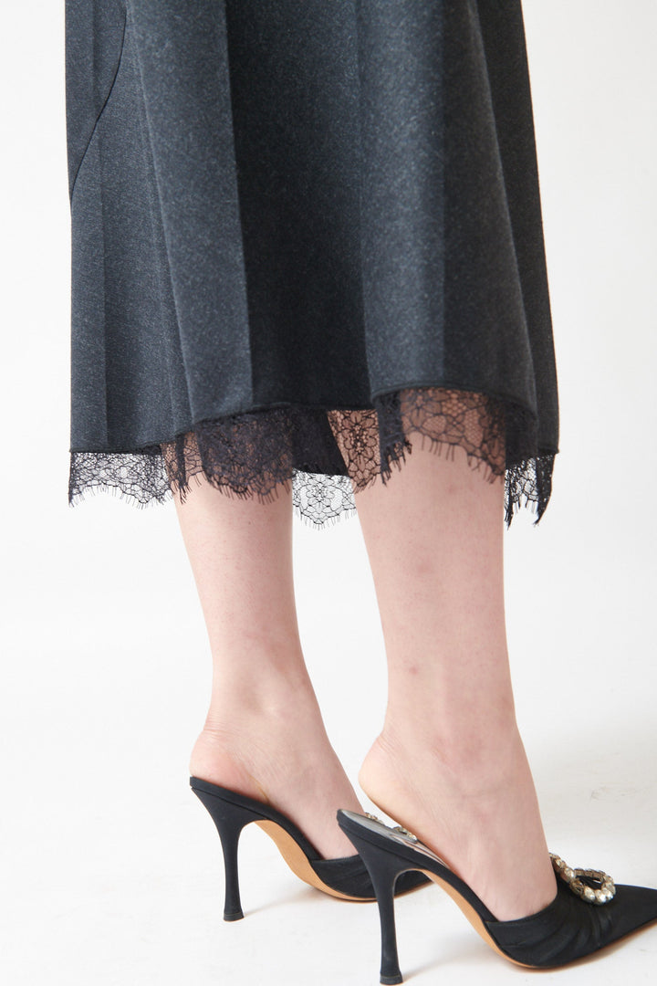 Lilly wearing Tela Tina Skirt detail bottom view