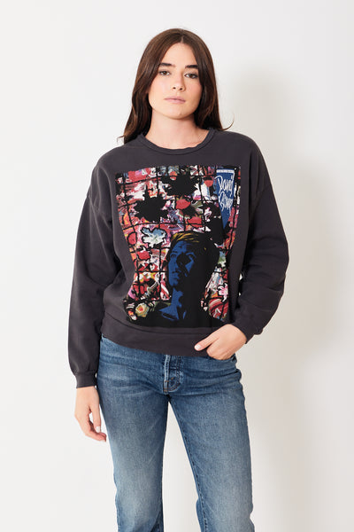 Front view of model wearing long sleeve dark gray tshirt with David Bowie graphic