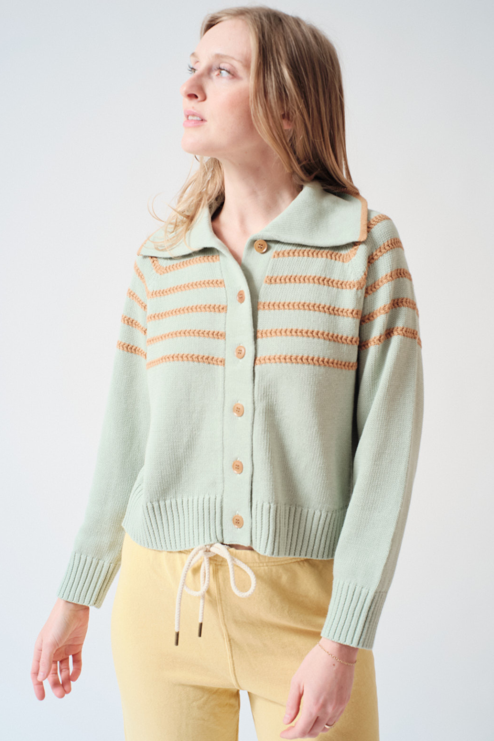Madi wearing The Great The Scholar Cardigan With Crochet Stripes front view