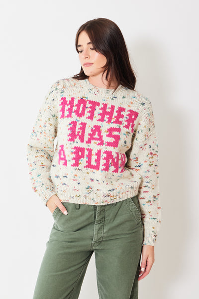 Front view of model wearing multicolored knit sweater with "MOTHER WAS A PUNK" slogan 