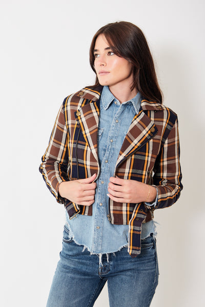 Front view of model wearing plaid moto jacket