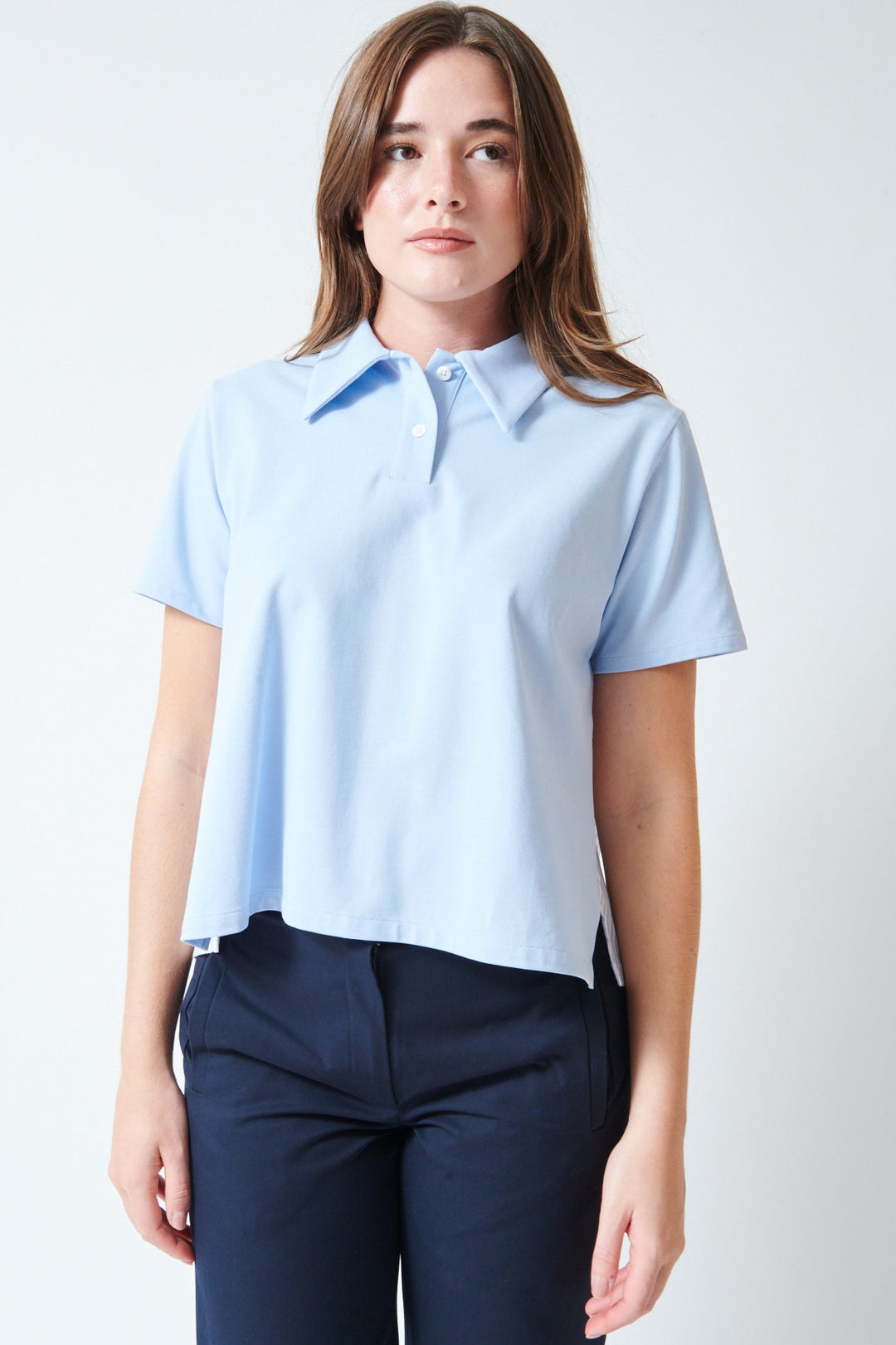 Julia wearing WE-AR4 The Media Polo Pale Blue Multi front view