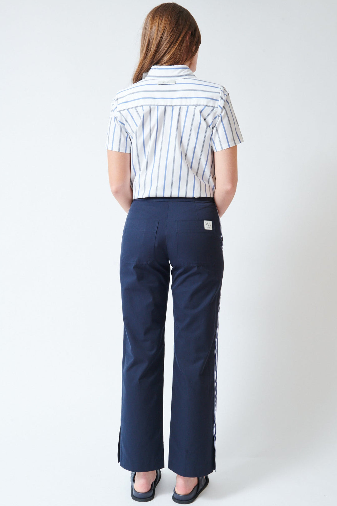 Julia wearing WE-AR4 The Street Pant Navy rear view