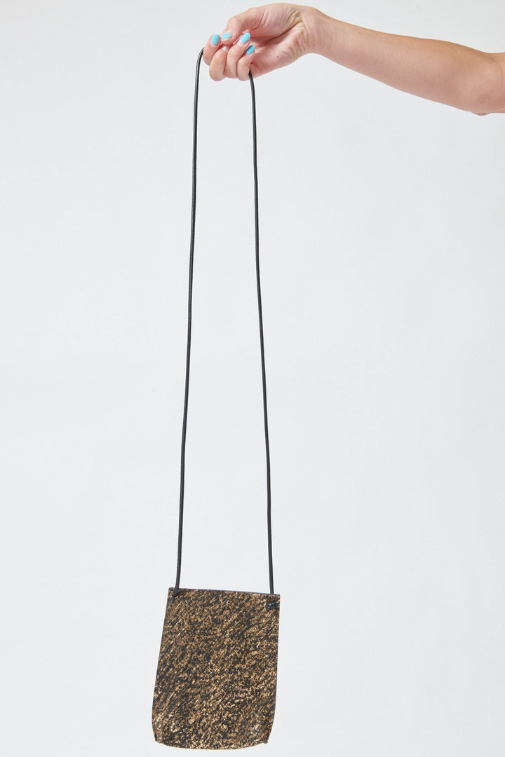 Model holding B.May Cell Pouch front view