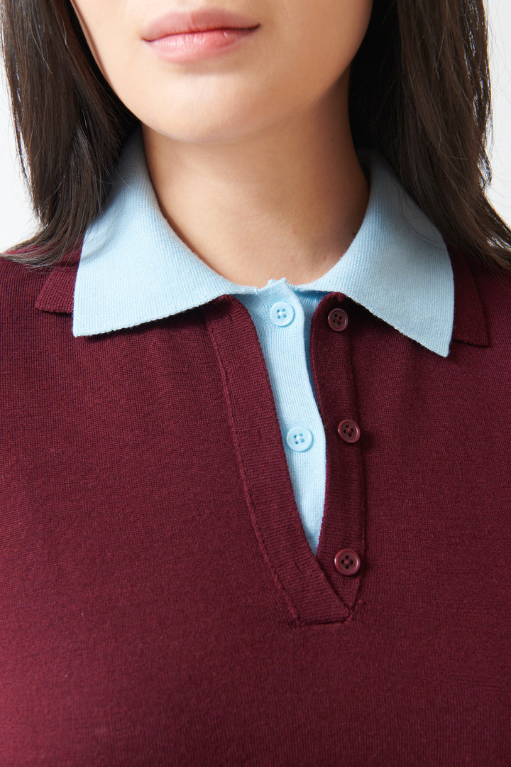Model wearing White + Warren Superfine Merino Layered Polo Black Cherry Light Blue Trim detail view