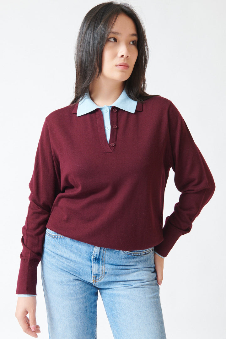 Model wearing White + Warren Superfine Merino Layered Polo Black Cherry Light Blue Trim front view