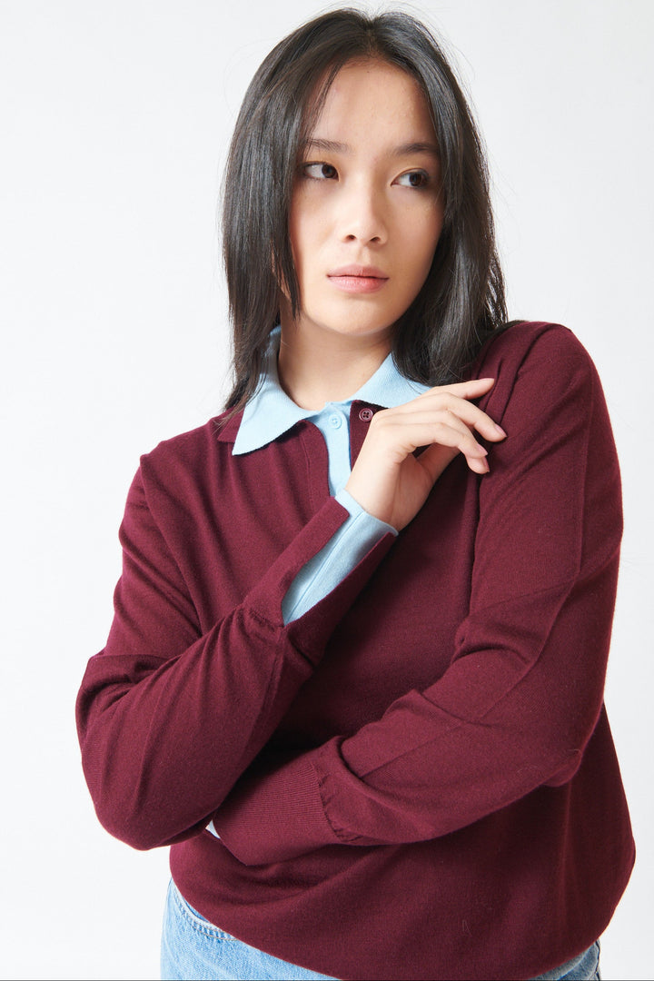 Model wearing White + Warren Superfine Merino Layered Polo Black Cherry Light Blue Trim front view