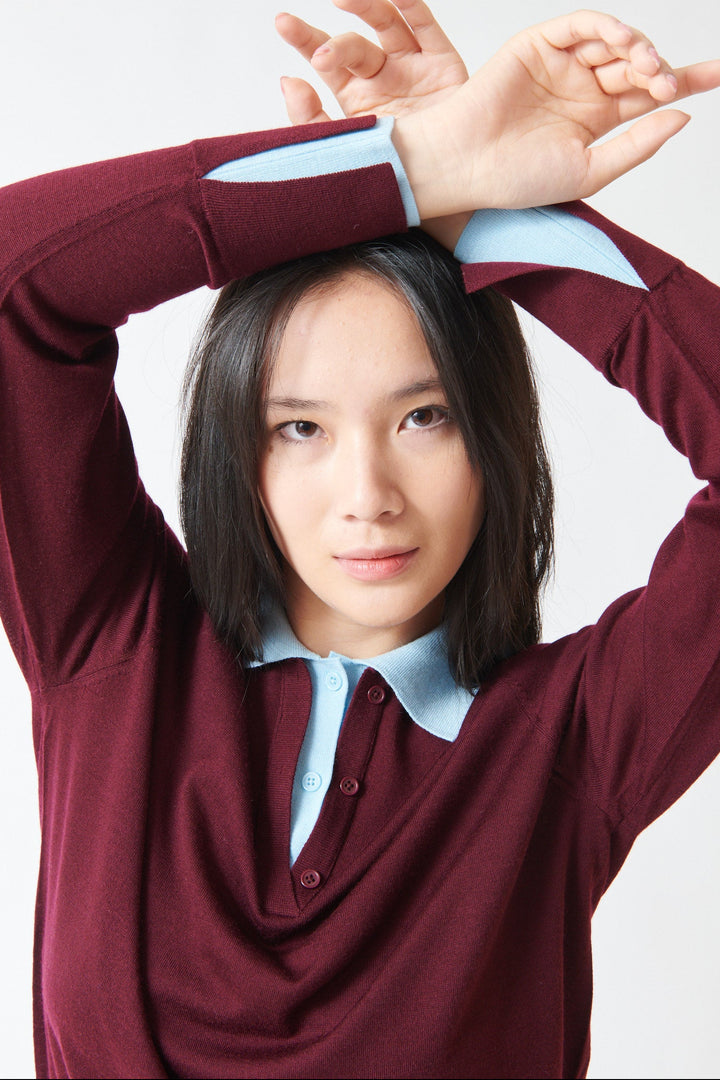Model wearing White + Warren Superfine Merino Layered Polo Black Cherry Light Blue Trim front view