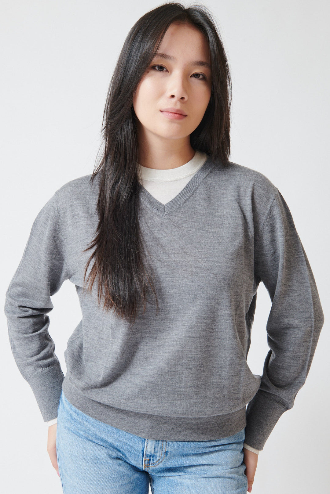 Lilly wearing White + Warren Superfine Merino Layered V Neck Pewter Heather Ivory Trim front view