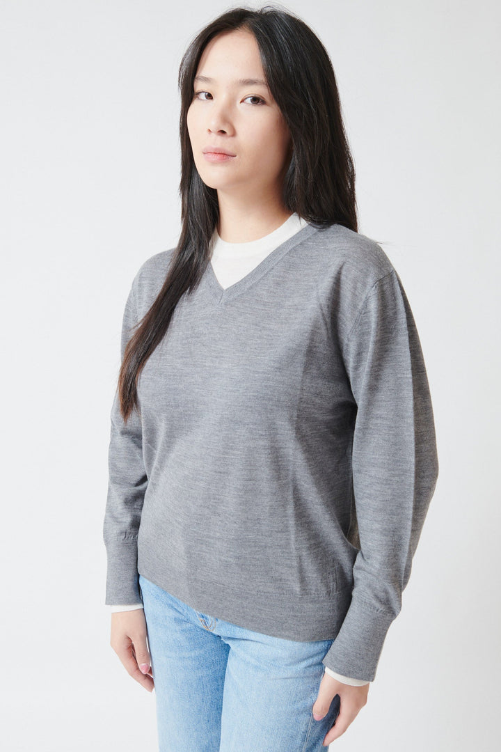 Lilly wearing White + Warren Superfine Merino Layered V Neck Pewter Heather Ivory Trim front/side view