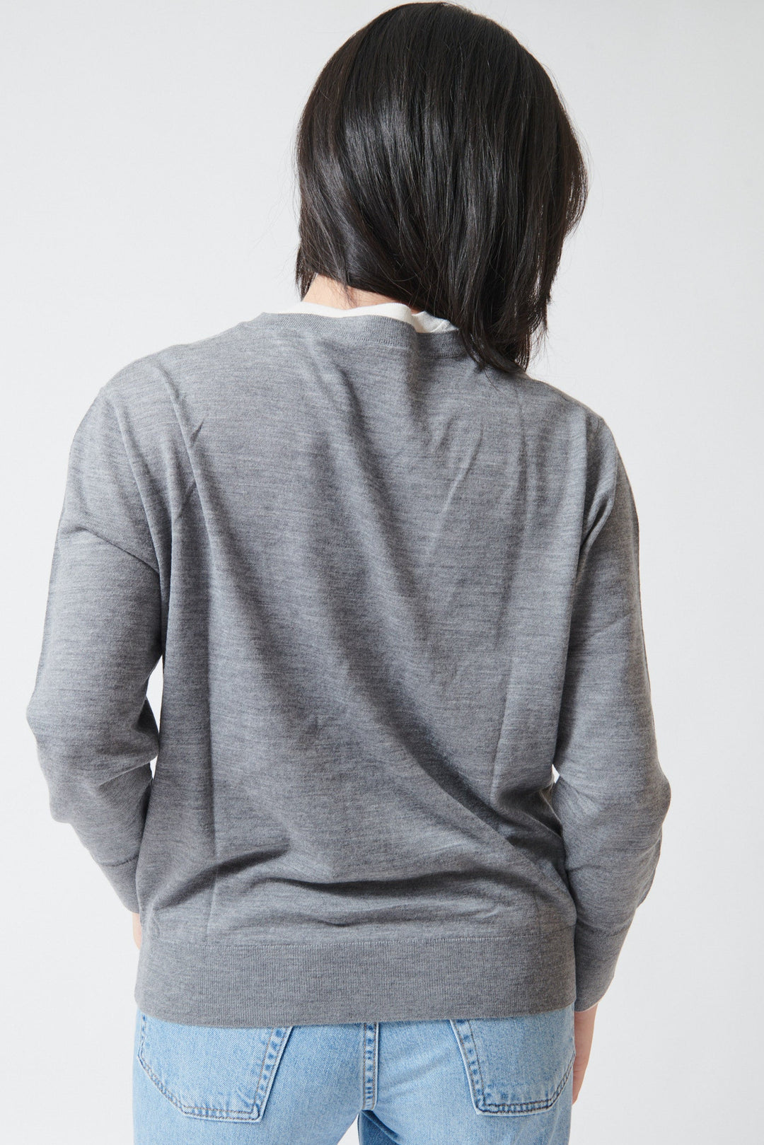 Lilly wearing White + Warren Superfine Merino Layered V Neck Pewter Heather Ivory Trim rear view