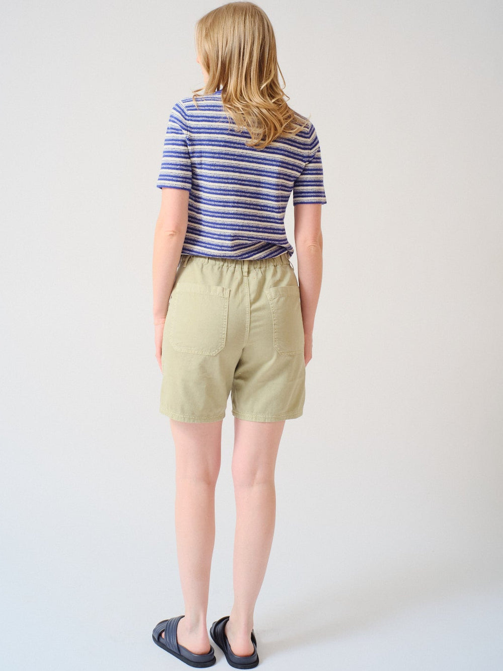 Madi wearing Xirena Toby Short rear view