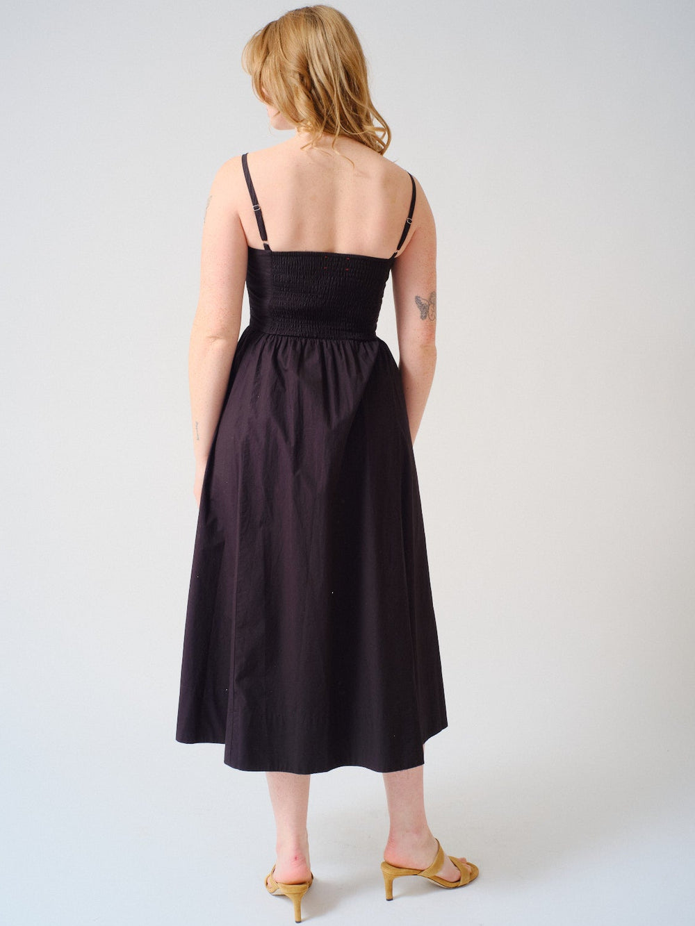 Waverly wearing Xirena Bardot Dress rear view