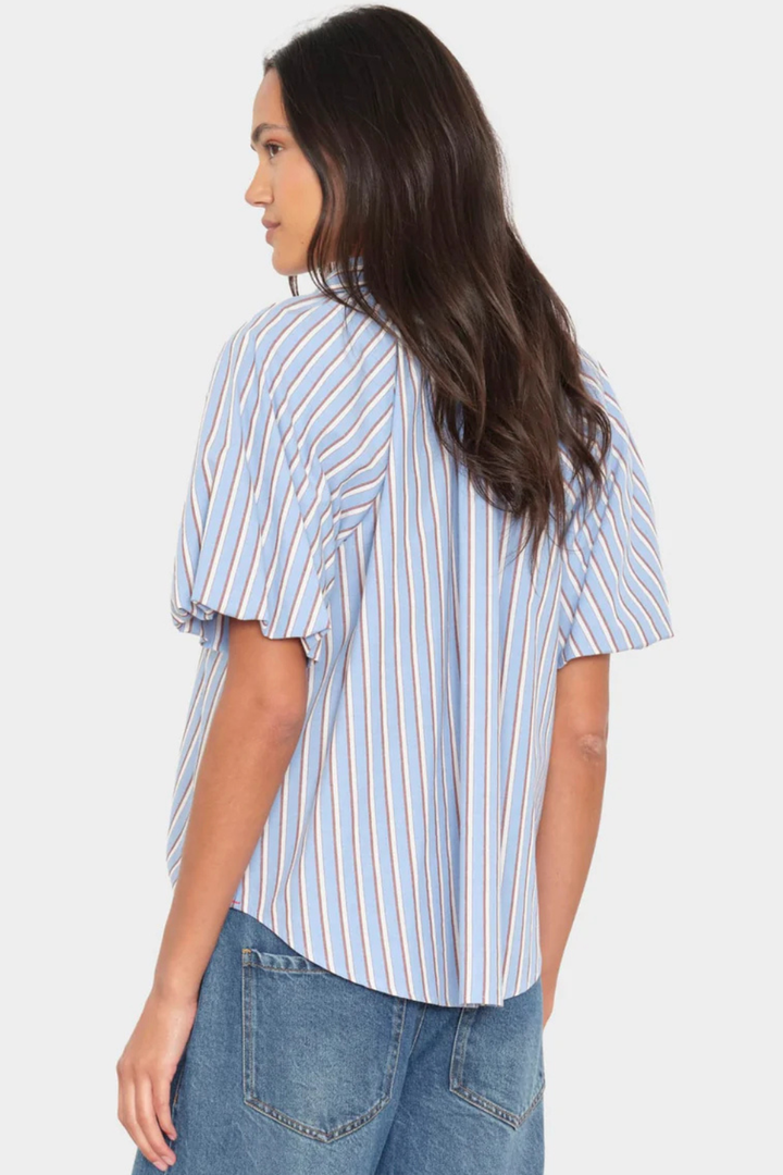 Model wearing Xirena Lyla Shirt Blue Cedar rear view
