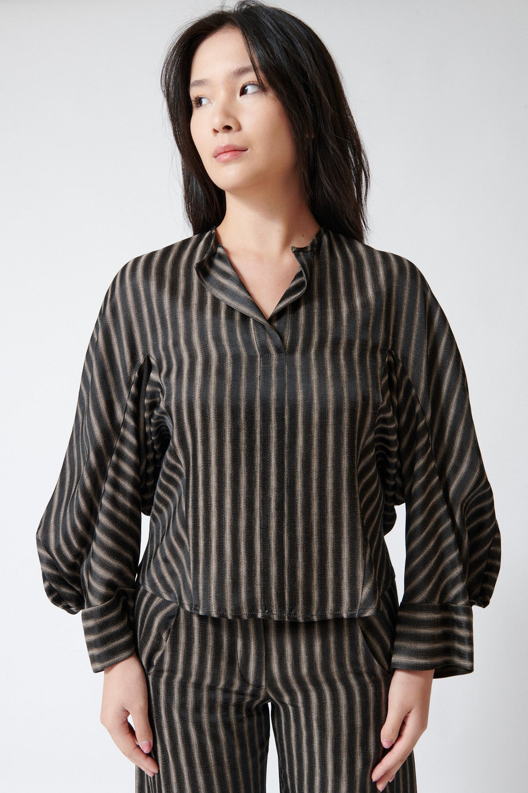 Lilly wearing Zero + Maria Cornejo Long Sleeve Blur Stripe Akeo Shirt Brown Black front view