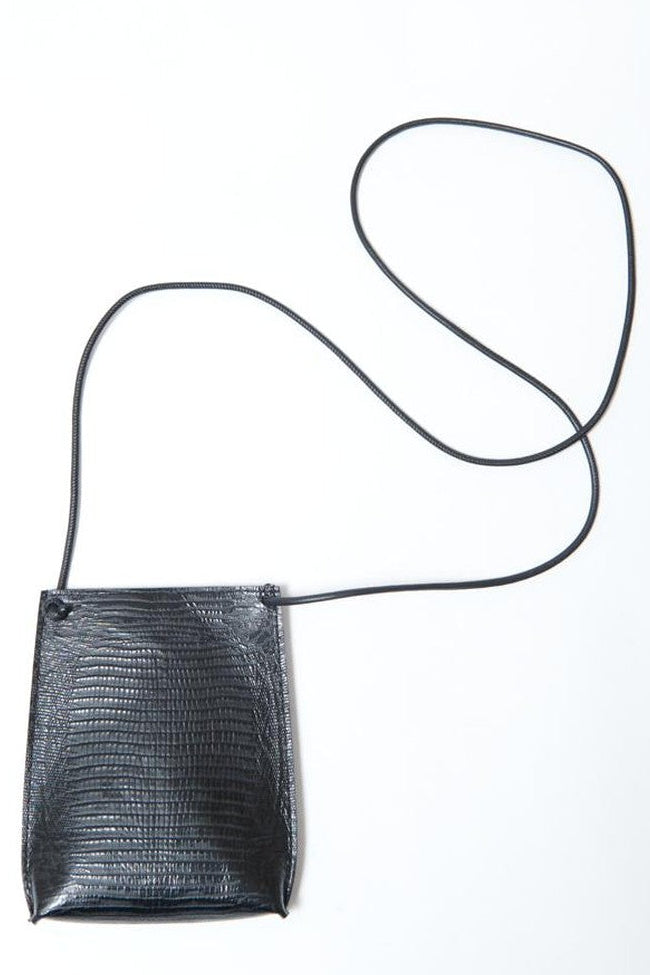 Flat lay Model wearing B.May Cell Pouch front 