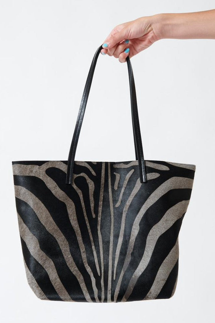 Model holding B.May Essential Tote front view