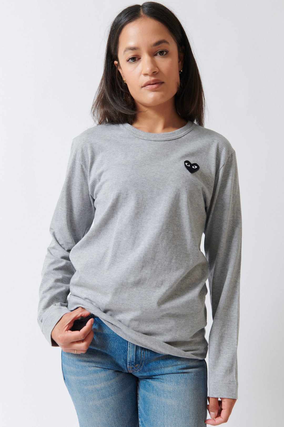 Amanda wearing Comme des Garçons PLAY Black Emblem Long Sleeve T Shirt Grey Black Heart front view
