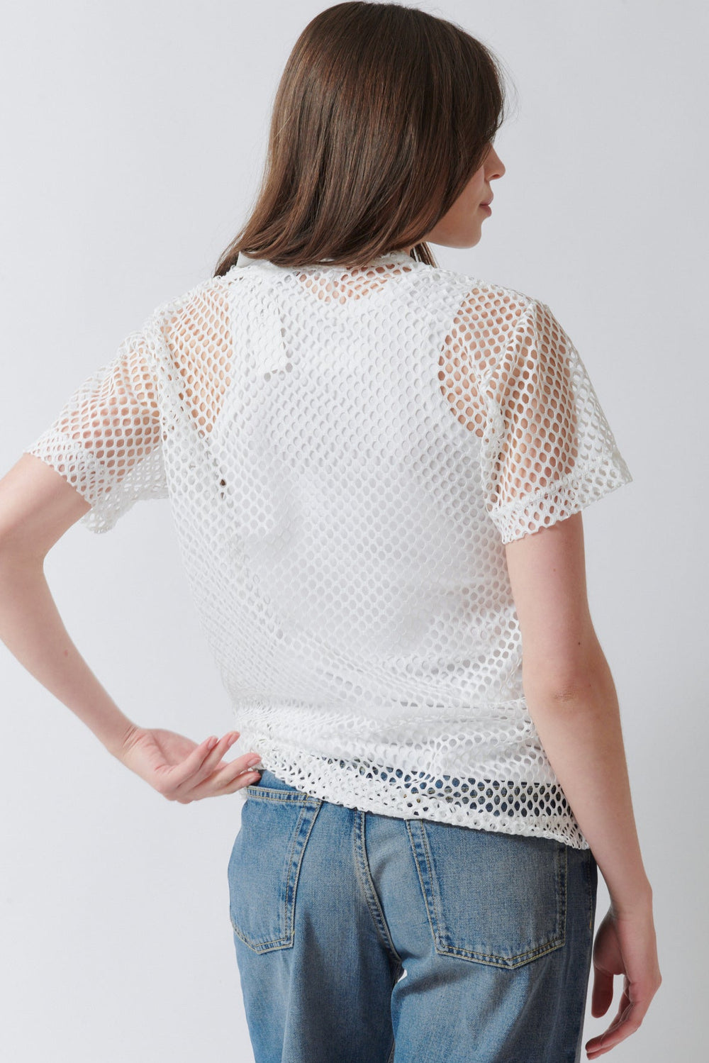 Angela wearing Comme des Garçons PLAY Black Heart Emblem Mesh Tee Shirt White rear view