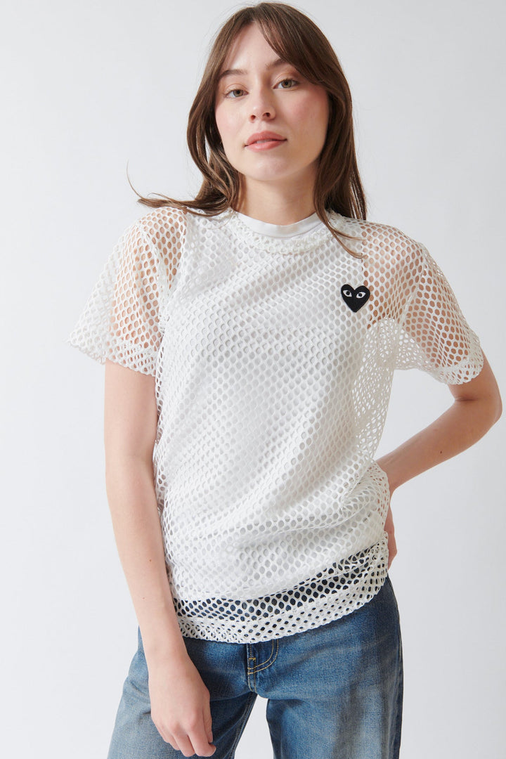 Angela wearing Comme des Garçons PLAY Black Heart Emblem Mesh Tee Shirt White front view