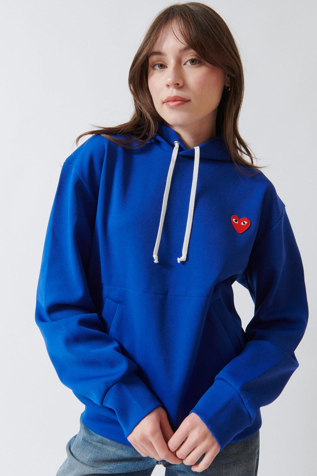Angela wearing Comme des Garçons PLAY Red Emblem Hooded Sweatshirt Navy front view