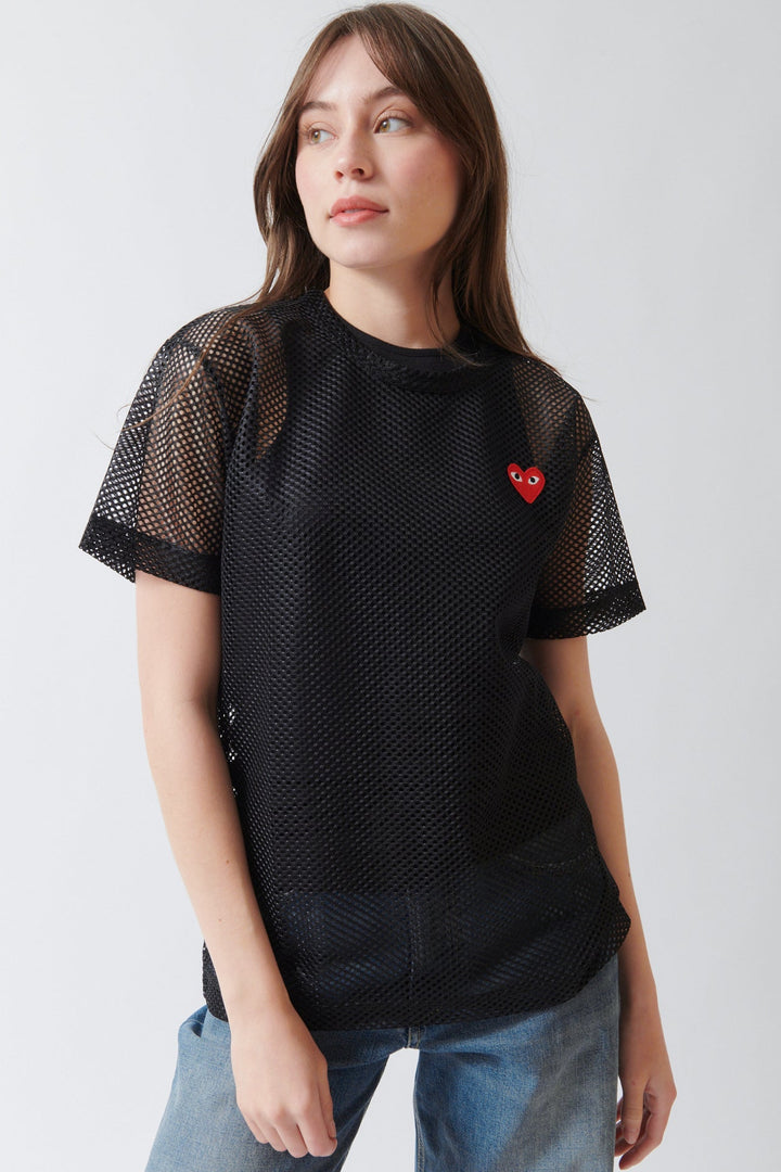 Angela wearing Comme des Garçons PLAY Red Heart Emblem Mesh Tee Shirt Black front view
