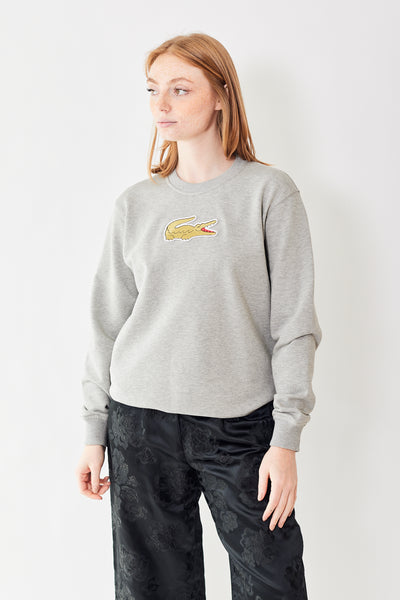Front of Comme des Garçons CDG x Lacoste Golden Alligator Sweatshirt on a model
