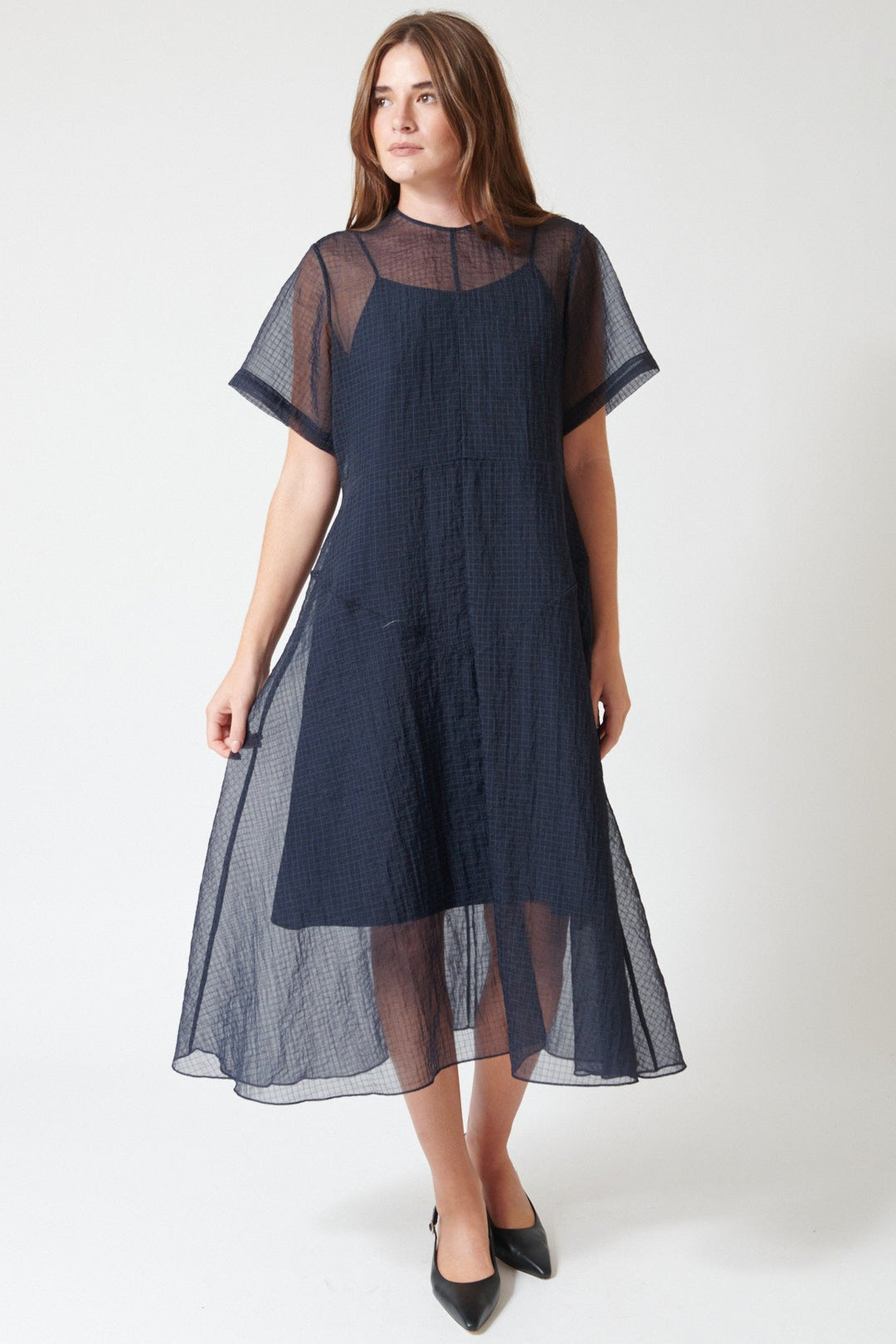 Julia wearing Fabiana Pigna Lumi Italian Techno Organza Dress in Midnight, front view.