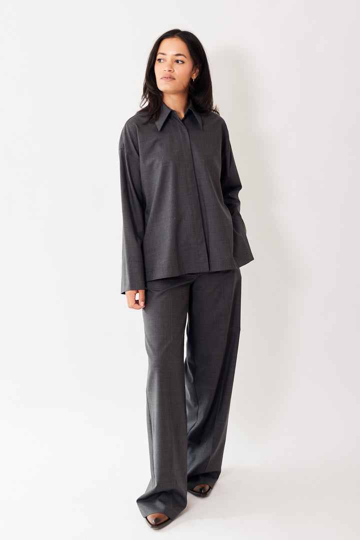 Amanda wearing Odeeh Virgin Wool Front And Side Button Blouse front view