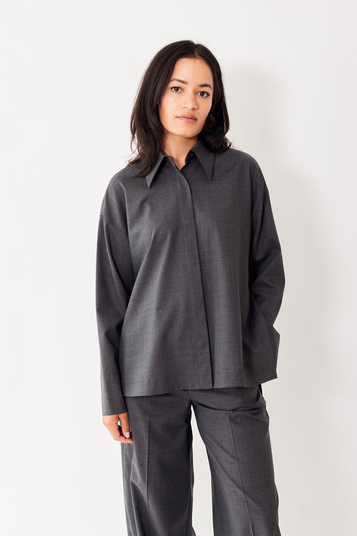 Amanda wearing Odeeh Virgin Wool Front And Side Button Blouse front view