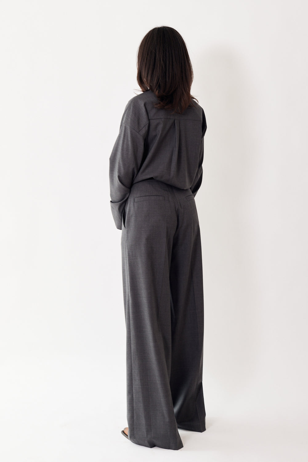 Amanda wearing Odeeh Virgin Wool Full Wide Leg Trouser rear view