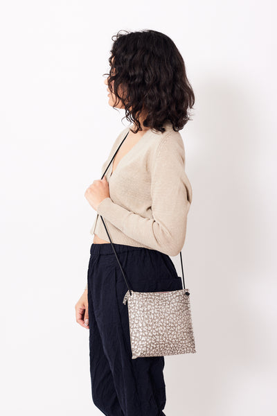 Amanda wearing B. May Strappy Pouch front view