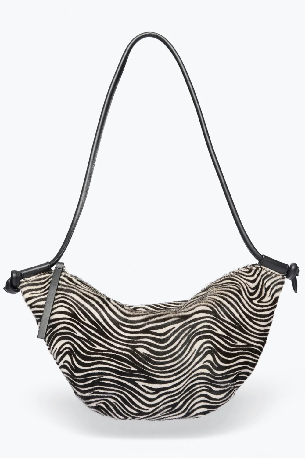 Flat lay of Frēda Salvador Elodie Crescent Bag Zebra Haircalf front view