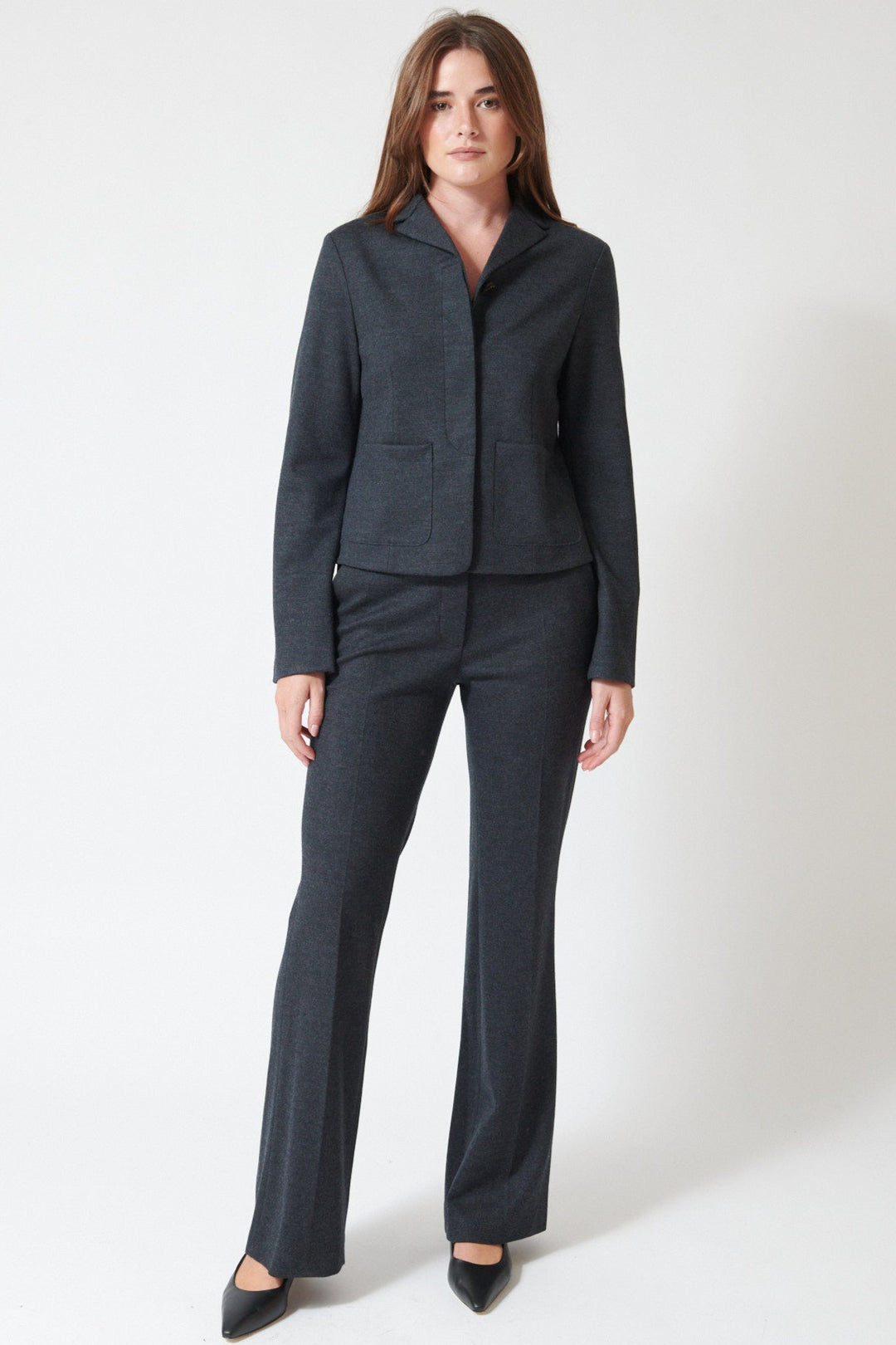Julia wearing Harris Wharf Superfine Merino Flared Fitted Trousers in Anthracite, front view.