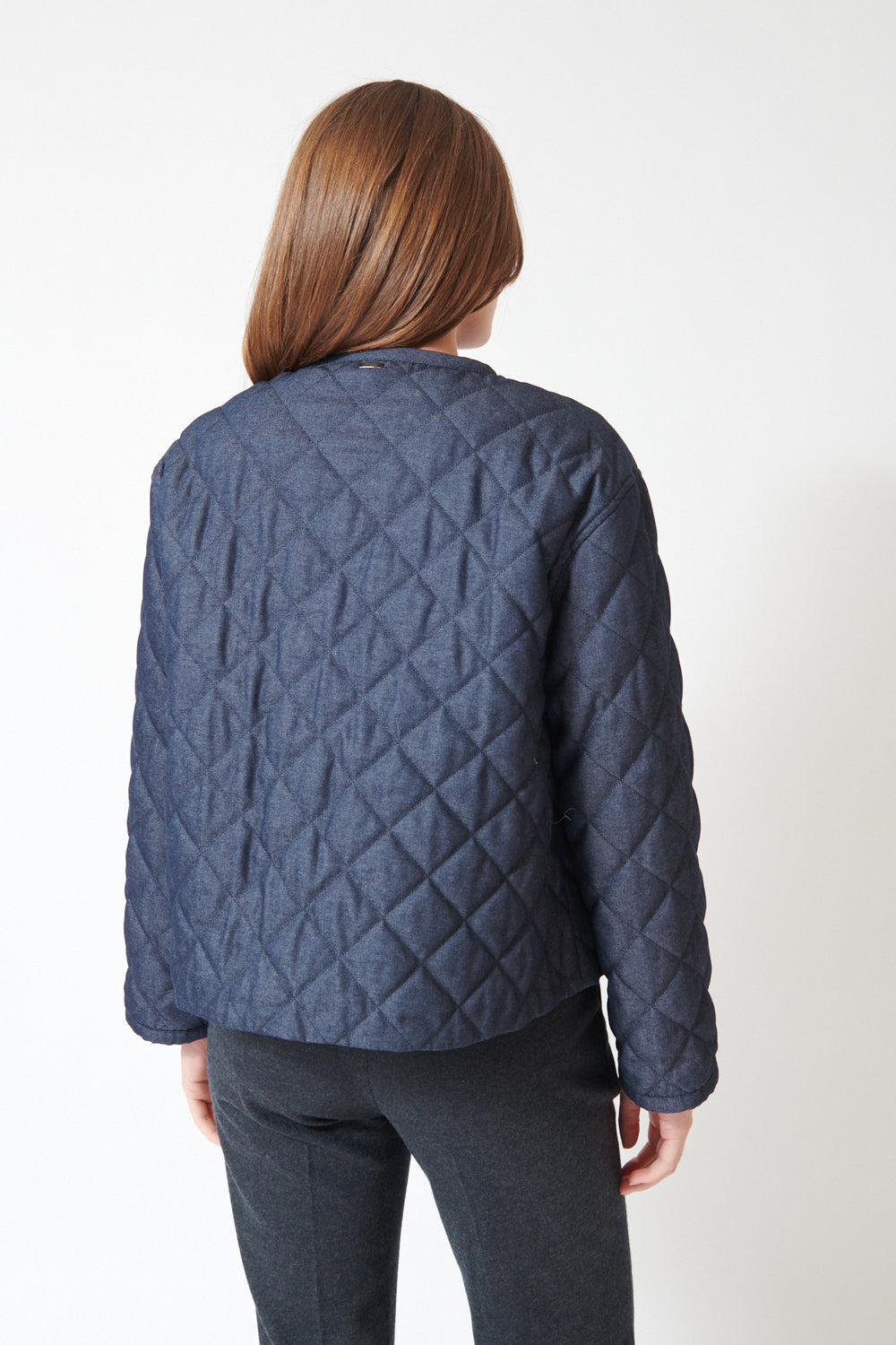 Julia wearing Herno Quilted 2 Way Zip Jacket in Blue, front view.
