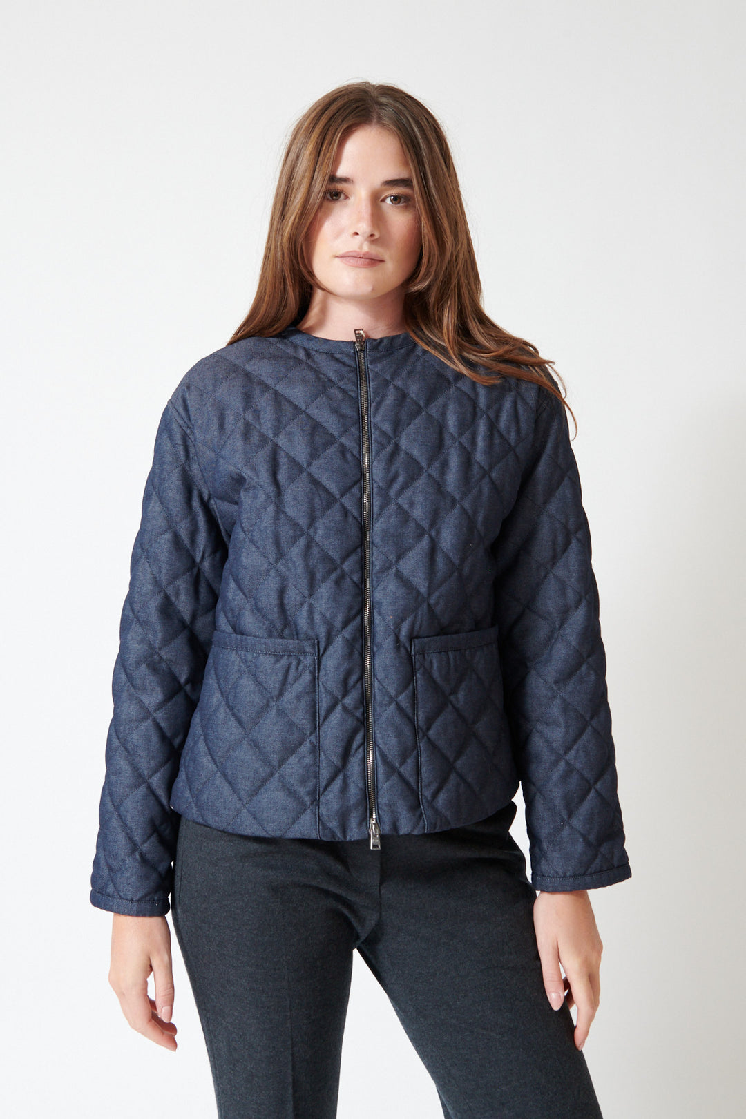 Julia wearing Herno Quilted 2 Way Zip Jacket in Blue, front view.