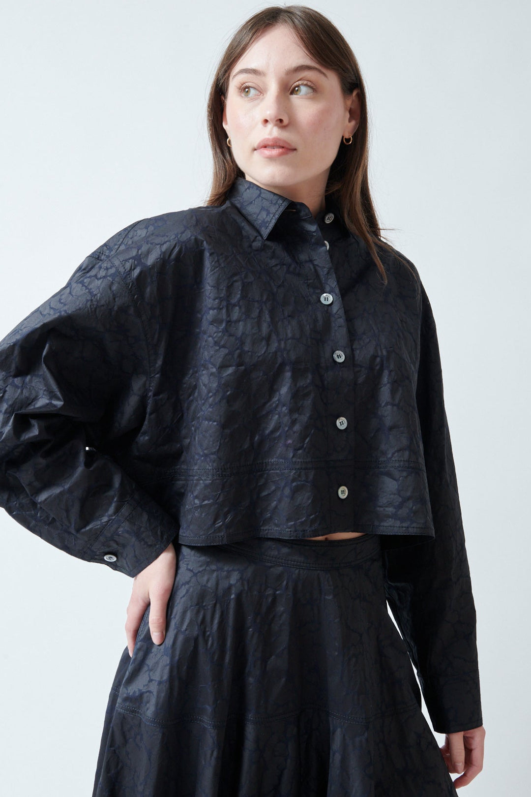 Angela wearing Mantu Janice Crop Blouse Chocolate Over Navy front view