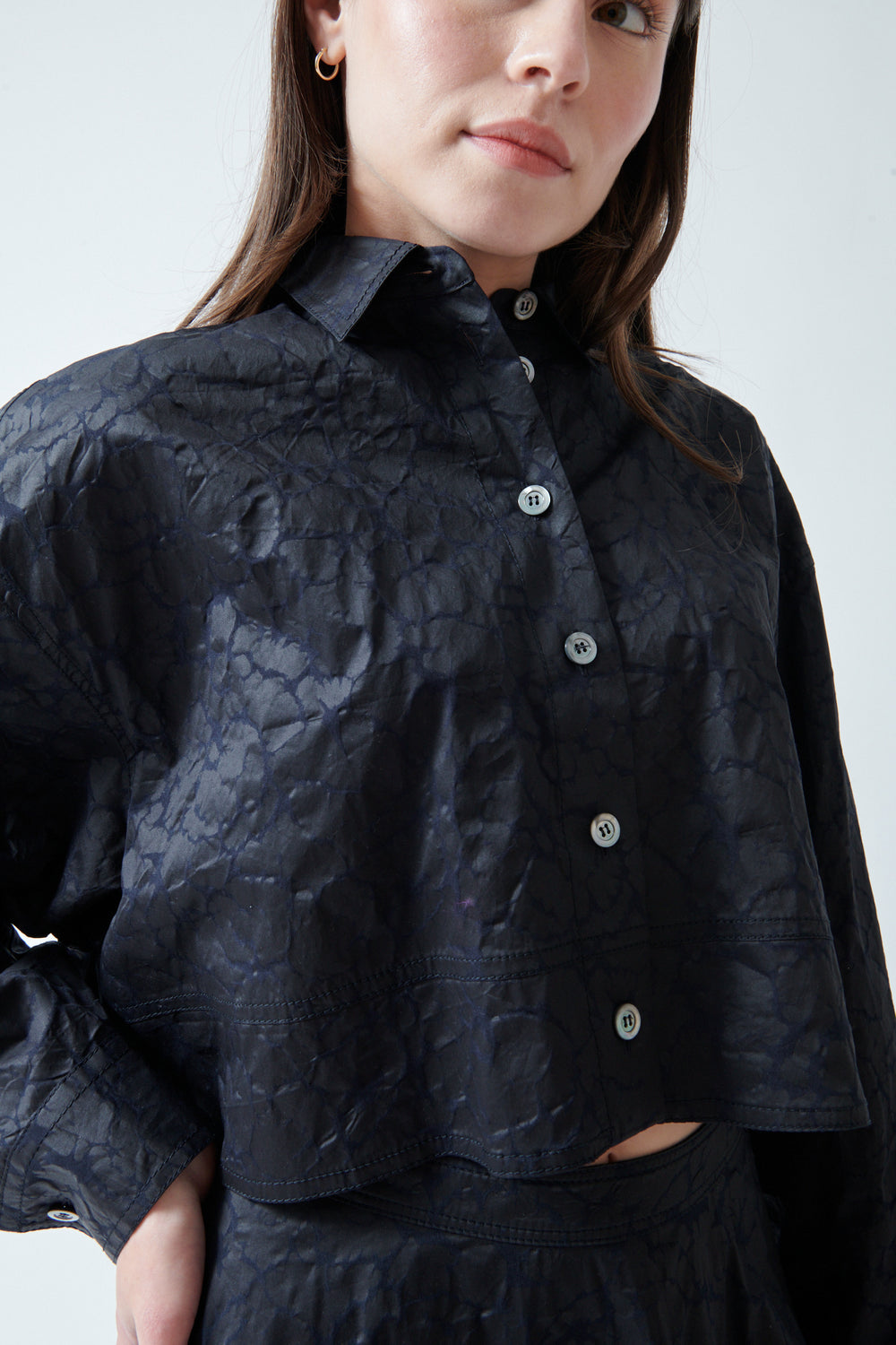 Angela wearing Mantu Janice Crop Blouse Chocolate Over Navy front/detail view