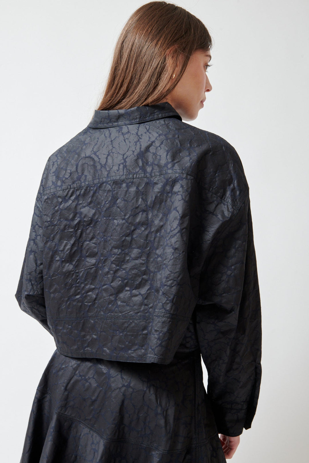 Angela wearing Mantu Janice Crop Blouse Chocolate Over Navy rear view