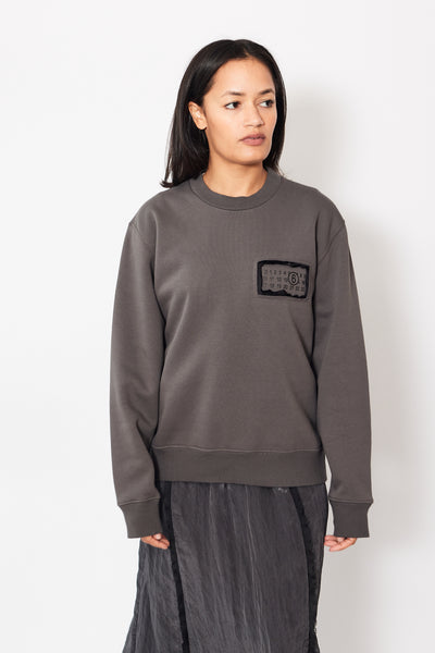 Front of MM6 Maison Margiela Cut Out 6 Sweatshirt on a model