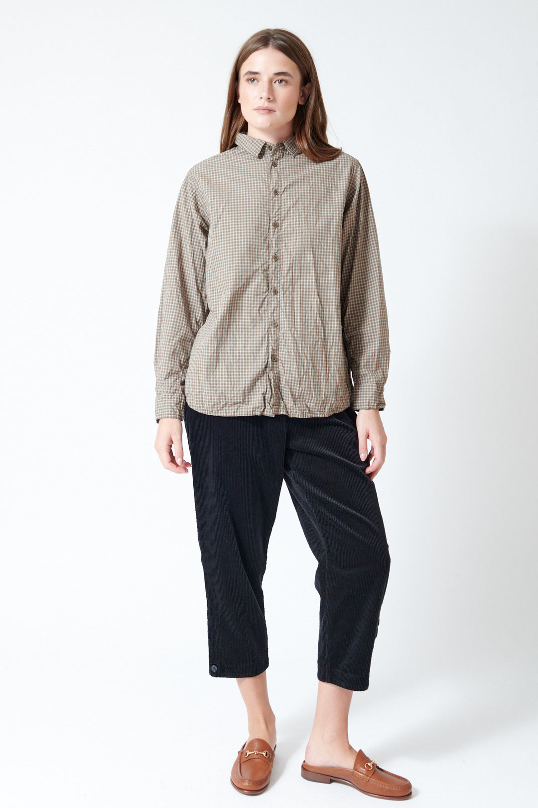 Julia wearing Pas de Calais Corduroy Tapered Pants in Black, front view.