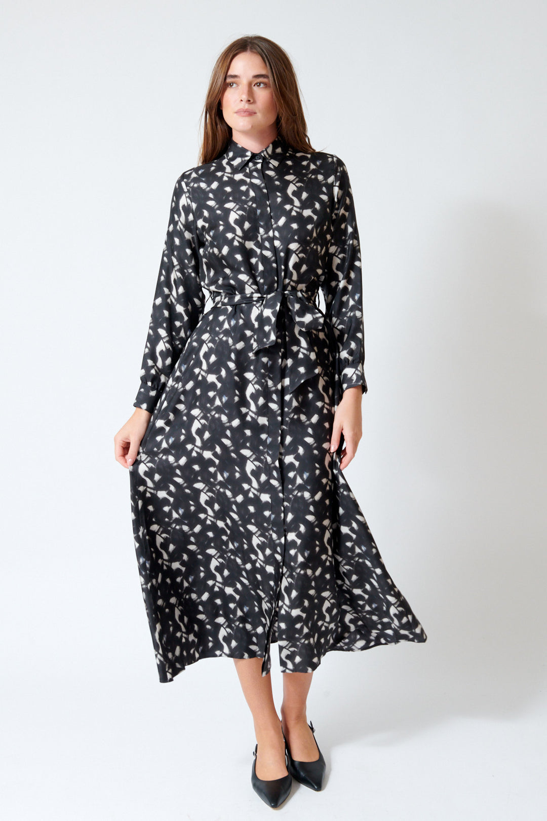 Julia wearing Rosso 35 Belted Button Down Silk Dress in Chalkboard, front view.