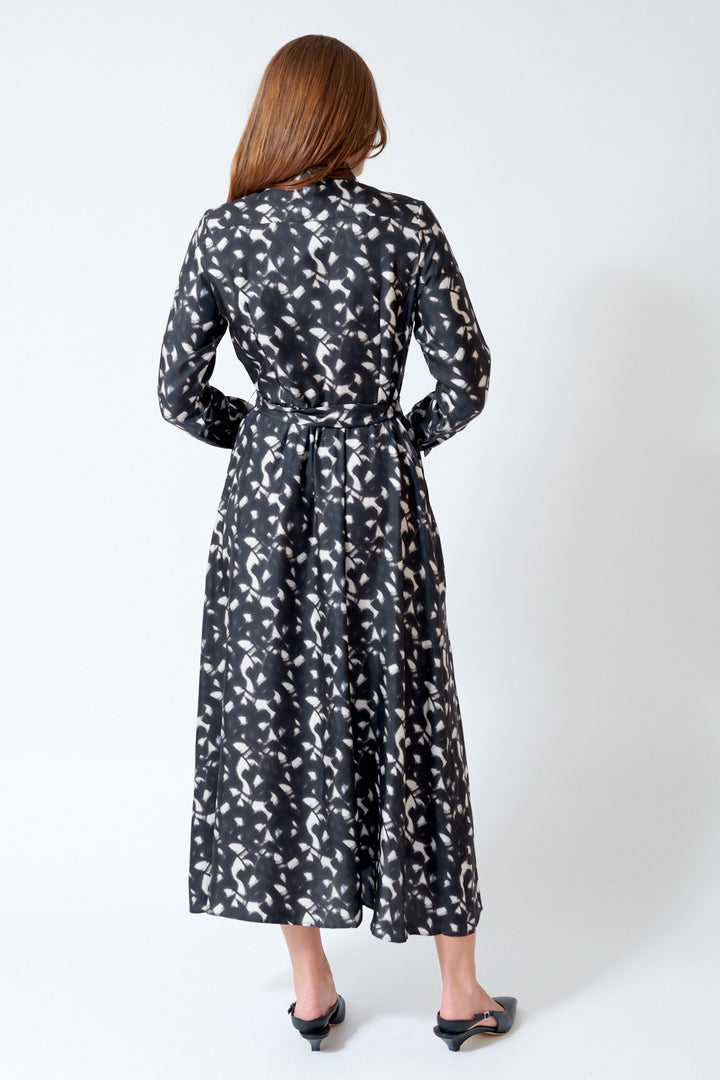 Julia wearing Rosso 35 Belted Button Down Silk Dress in Chalkboard, rear view.