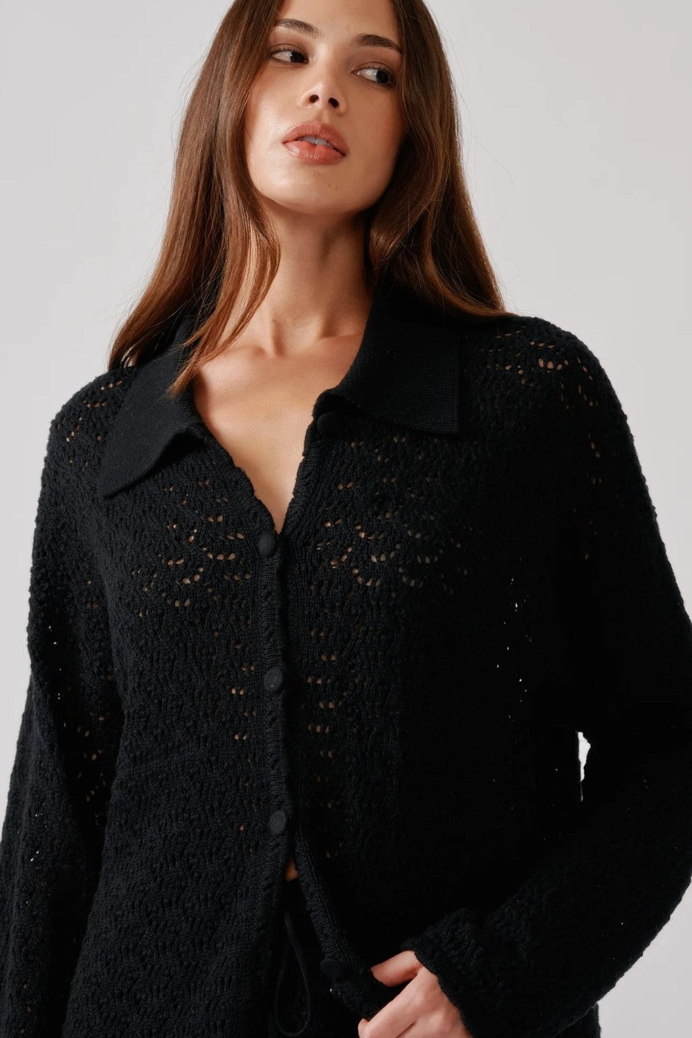 Model wearing the Sablyn Crochet relaxed button up shirt  called Izzy in black sold at Grethen House.