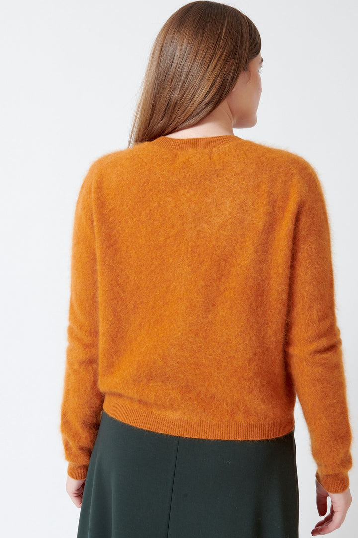 Model wearing Meimeij Taylor Cardigan rear view