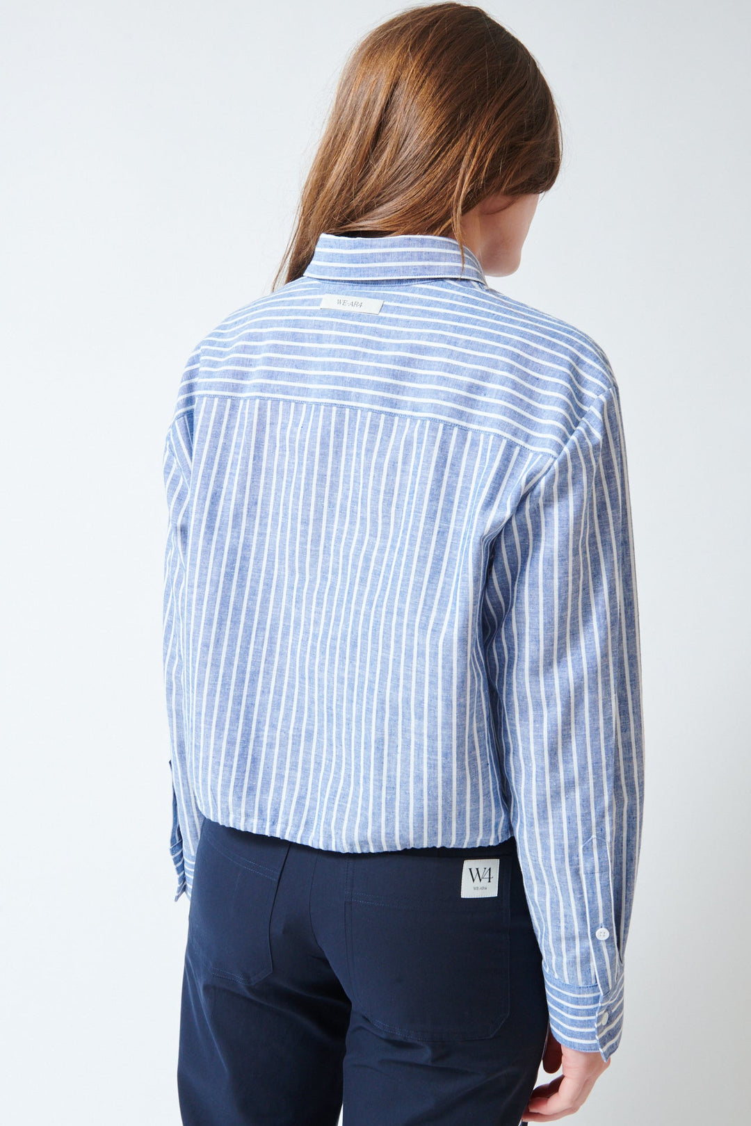 Julia wearing WE-AR4 The Riva Shirt Blue Stripe rear view